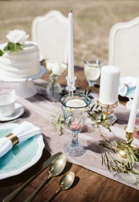 Outdoor wedding table setting in field